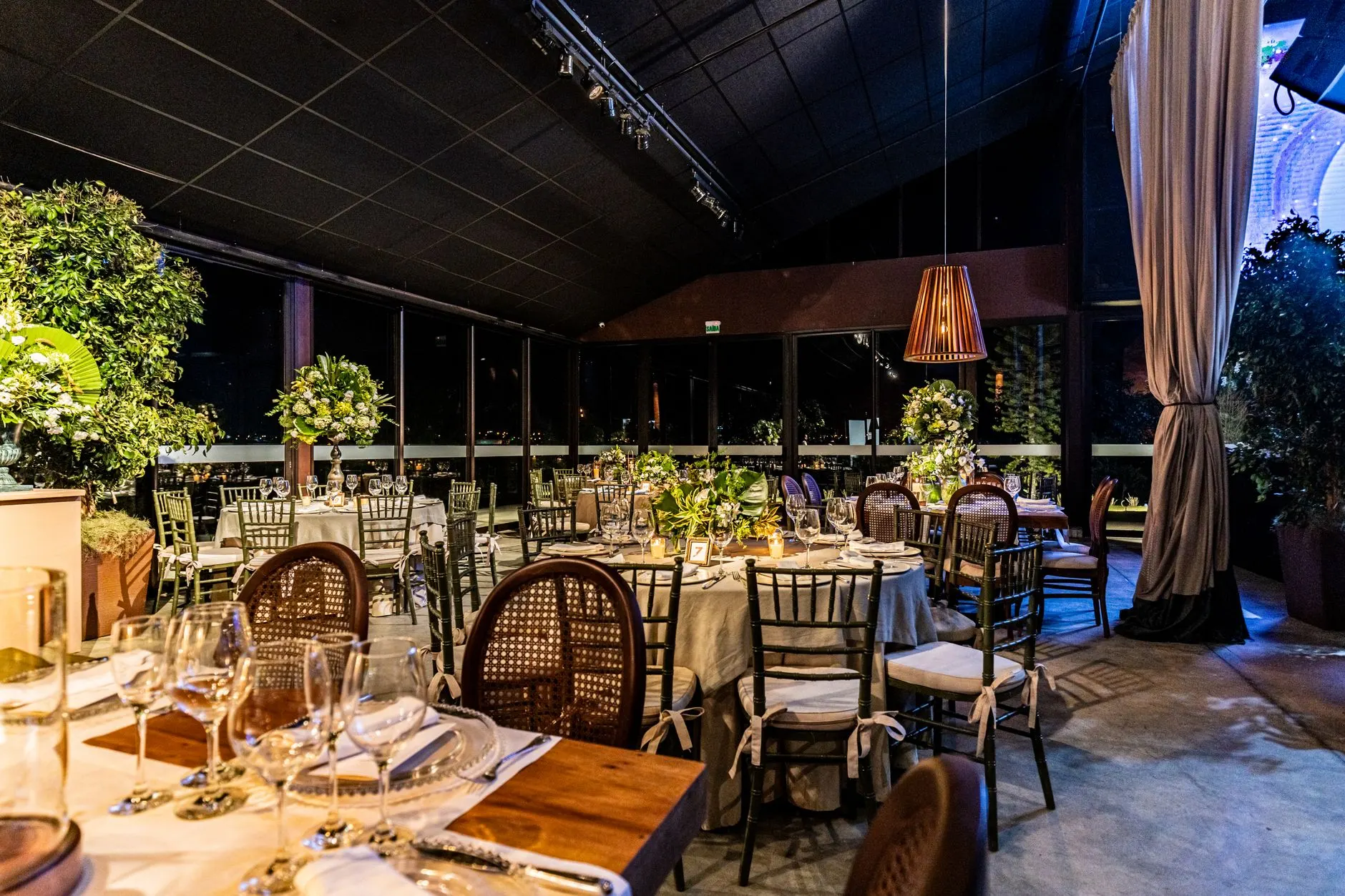 A cozy interior of a boutique event venue with elegant decorations and tables pr